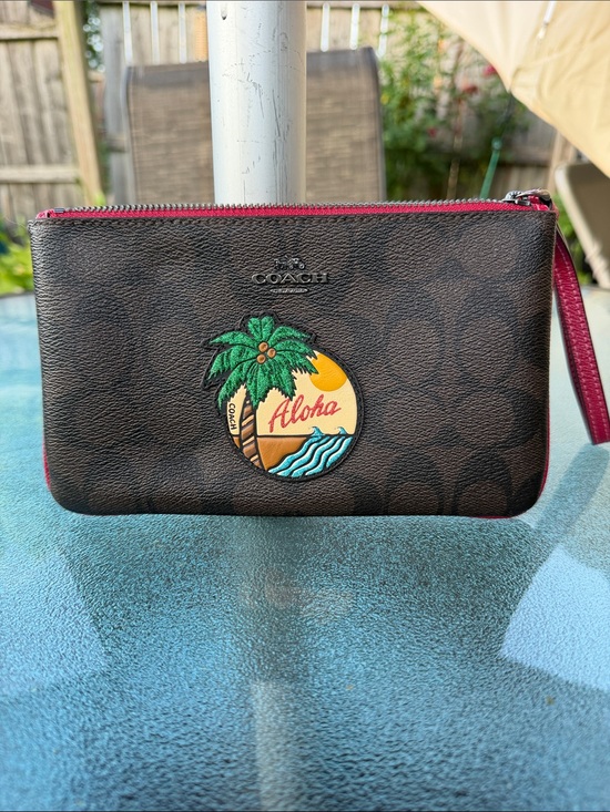 Coach Handbags - Coach Brown Signature Wristlet with Aloha Patch and Pink Trim